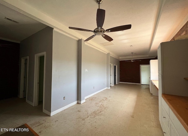 unfurnished living room featuring ceiling fan