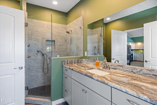 bathroom featuring vanity and walk in shower