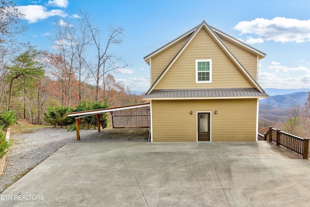 view of side of home with a mountain view