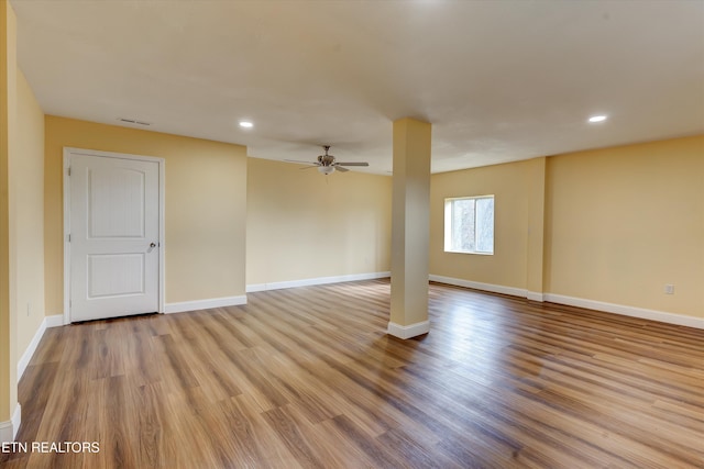 spare room featuring light hardwood / wood-style floors and ceiling fan