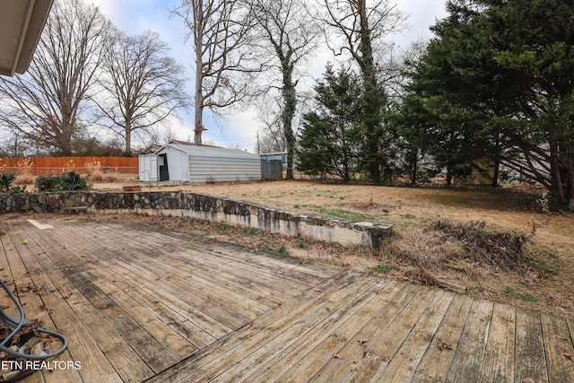 wooden deck featuring a storage shed