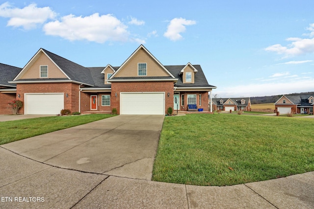 view of front facade featuring a front yard and a garage