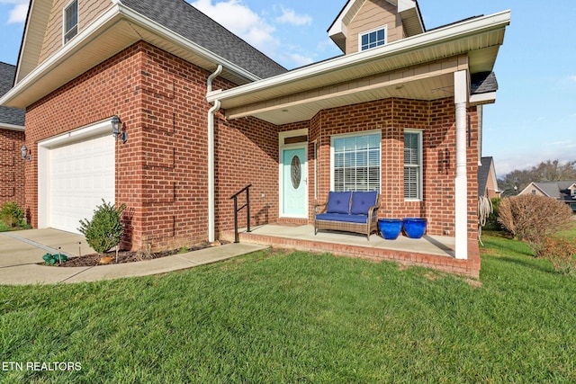 view of front of home with a porch, a front yard, and a garage