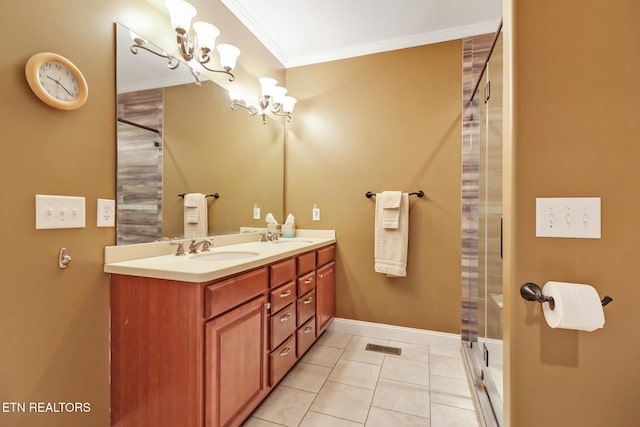 bathroom with tile patterned floors, vanity, crown molding, a shower, and a chandelier