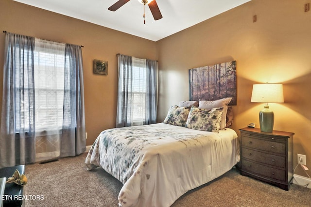 bedroom with ceiling fan and carpet floors