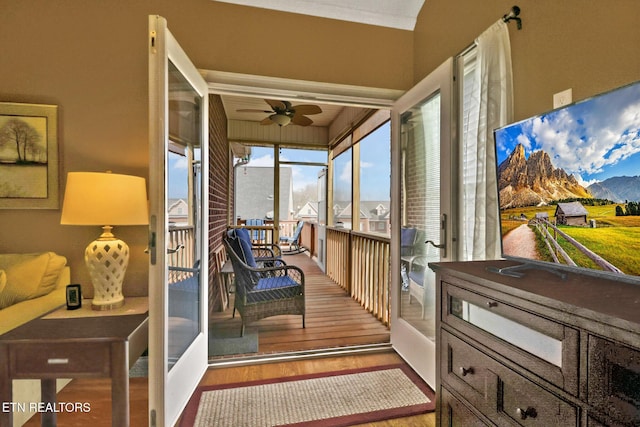 sunroom / solarium with ceiling fan