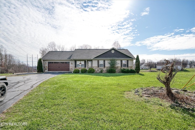 view of front of house featuring a garage and a front yard