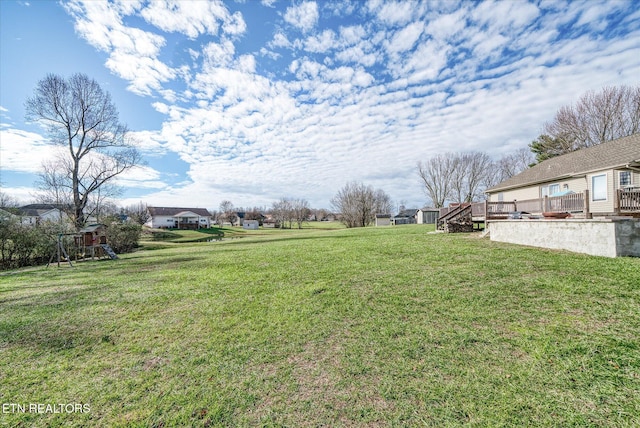 view of yard with a deck