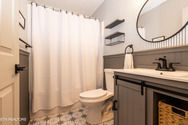 full bathroom with shower / tub combo, vanity, and toilet