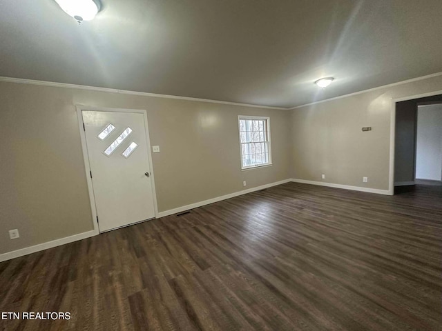 foyer entrance featuring dark hardwood / wood-style floors and ornamental molding