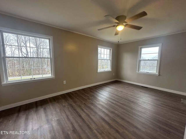 empty room featuring ceiling fan, dark hardwood / wood-style flooring, and ornamental molding