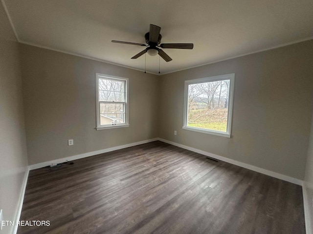 unfurnished room with dark hardwood / wood-style floors, ceiling fan, and crown molding