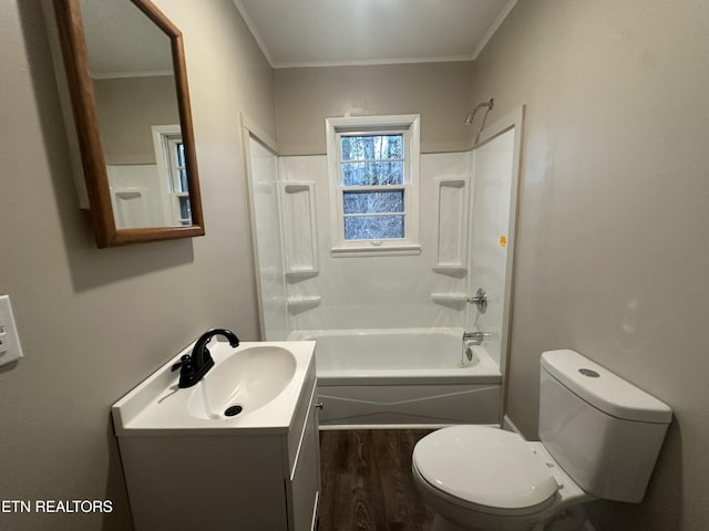 full bathroom featuring vanity, crown molding, toilet, shower / bathing tub combination, and hardwood / wood-style flooring