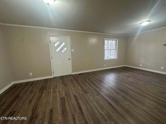 foyer entrance with dark hardwood / wood-style floors and crown molding