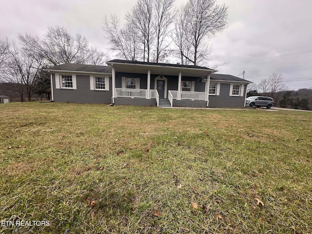 ranch-style house with a porch and a front yard