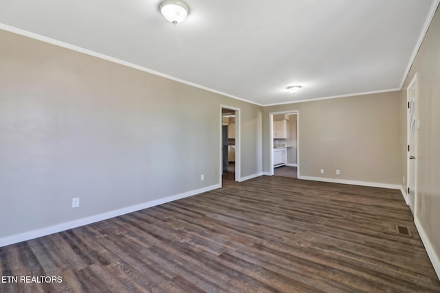 423 S Main St, Byrdstown, TN 38549 - empty room with dark wood-type flooring, ornamental molding, and baseboards