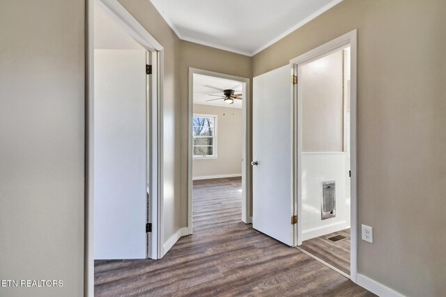 423 S Main St, Byrdstown, TN 38549 - hallway featuring wood finished floors, baseboards, ornamental molding, and visible vents