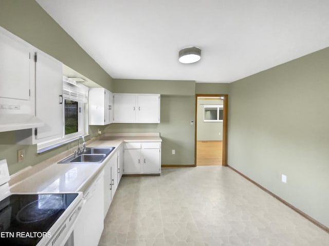 kitchen featuring stove, sink, dishwasher, white cabinets, and range hood