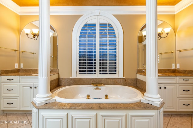 bathroom with decorative columns, crown molding, and vanity