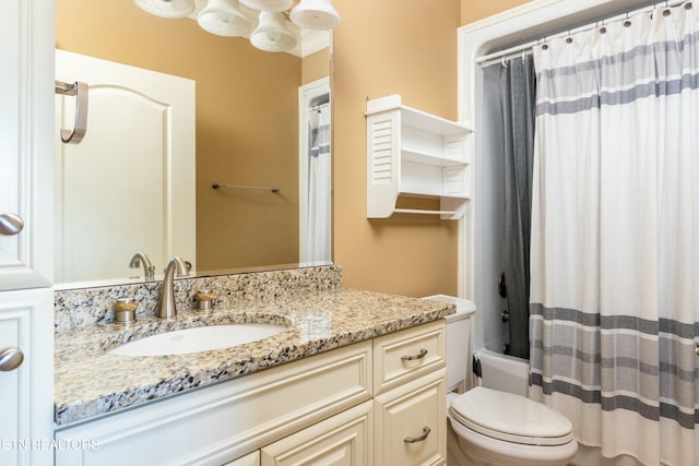 full bathroom with shower / bath combo with shower curtain, vanity, and toilet