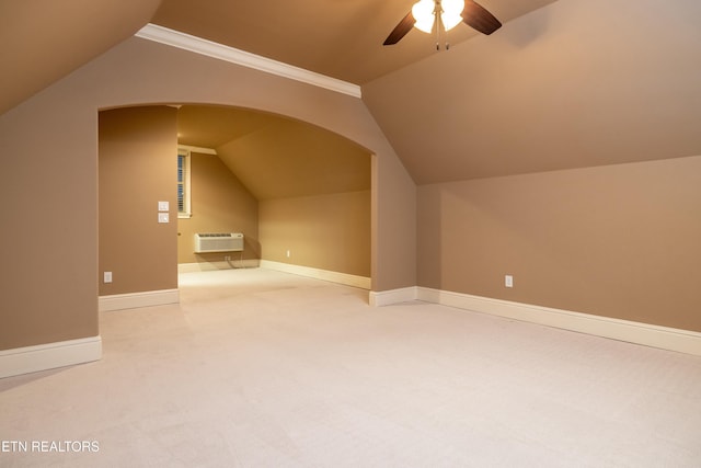 bonus room with carpet flooring, a wall mounted air conditioner, ceiling fan, and lofted ceiling