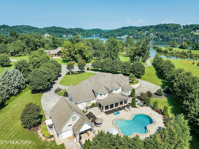 drone / aerial view with a water view