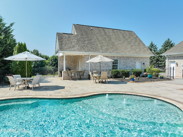 view of swimming pool featuring a patio