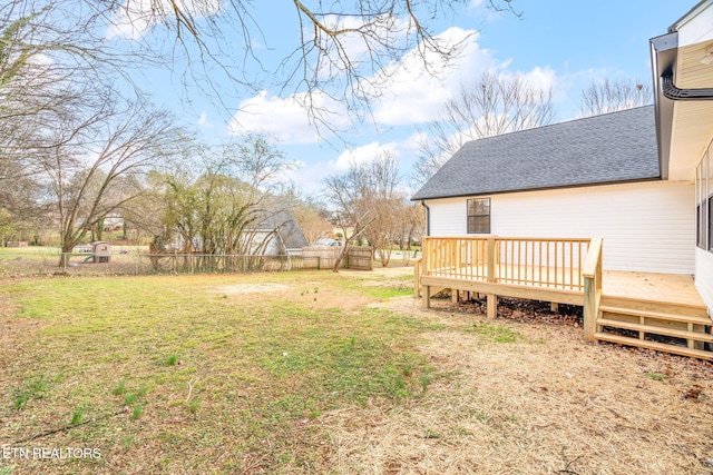 view of yard with a wooden deck