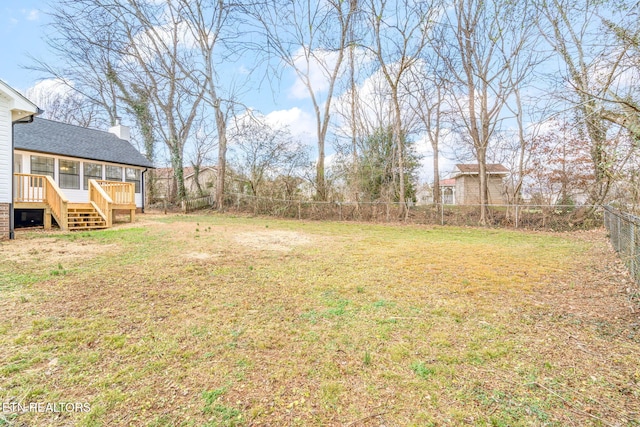 view of yard with a wooden deck