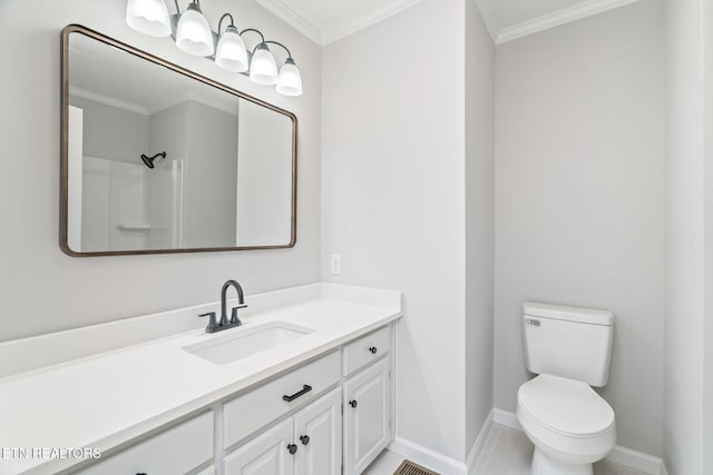 bathroom featuring vanity, toilet, and ornamental molding