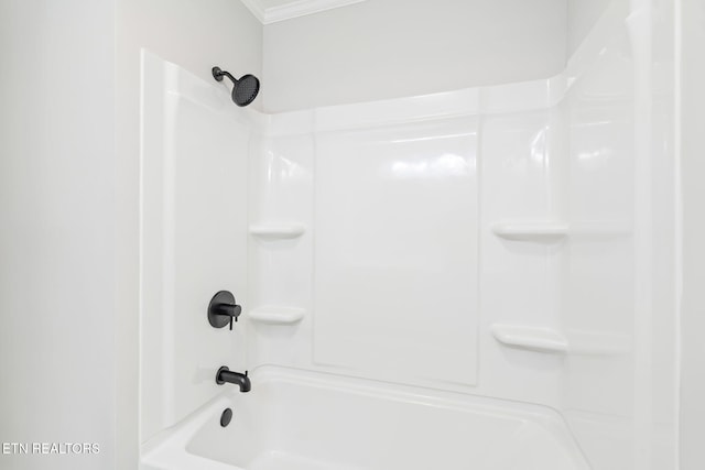 bathroom featuring shower / washtub combination and crown molding