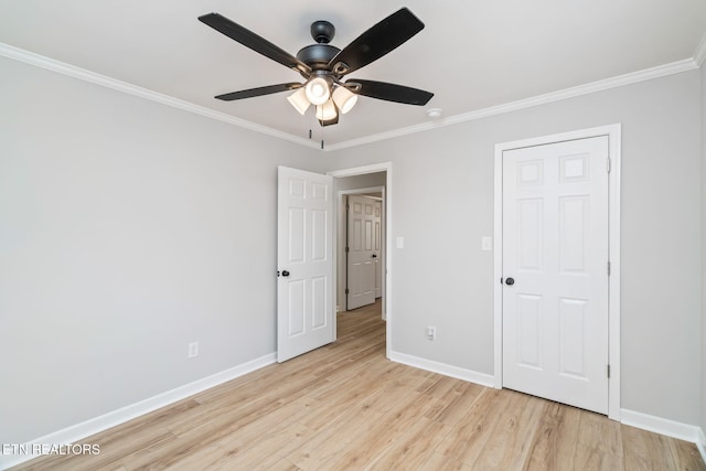 unfurnished bedroom featuring ceiling fan, light wood-type flooring, and ornamental molding