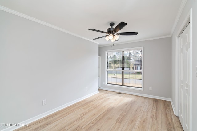 unfurnished bedroom with ceiling fan, light hardwood / wood-style floors, and crown molding