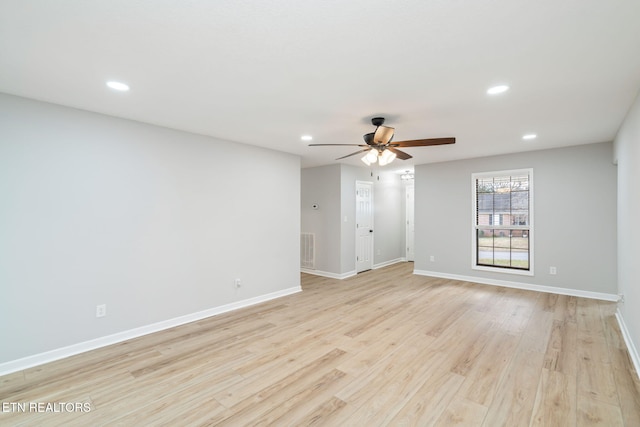 unfurnished room with light hardwood / wood-style floors