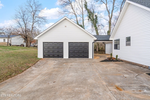 garage with a lawn