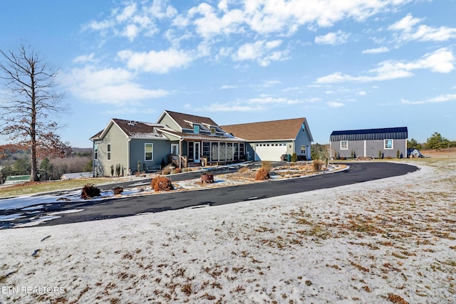 back of house featuring a garage