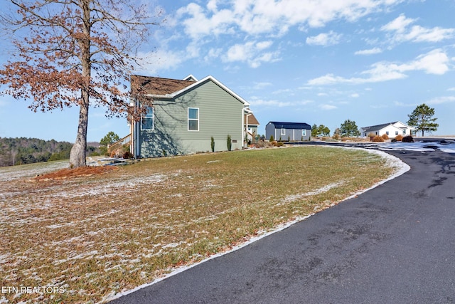 view of property exterior featuring a yard