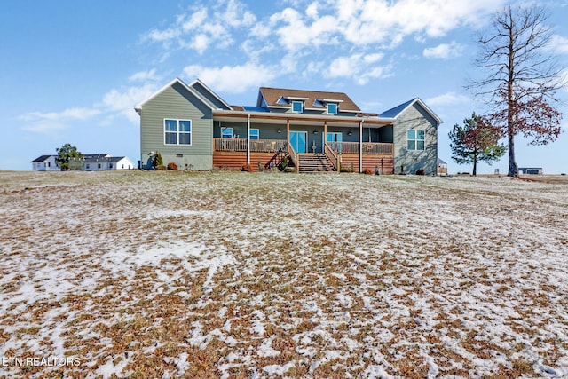 rear view of house with covered porch