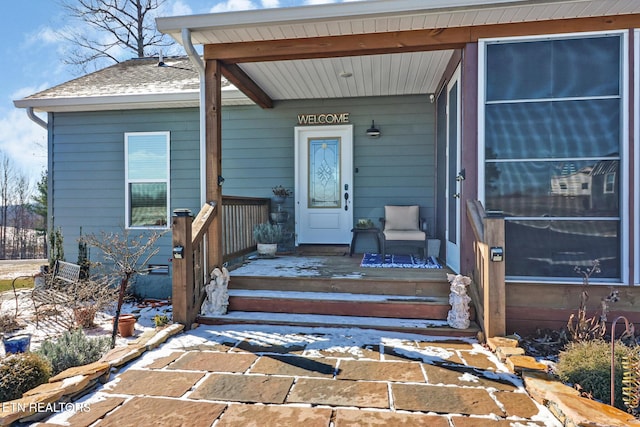 doorway to property with covered porch