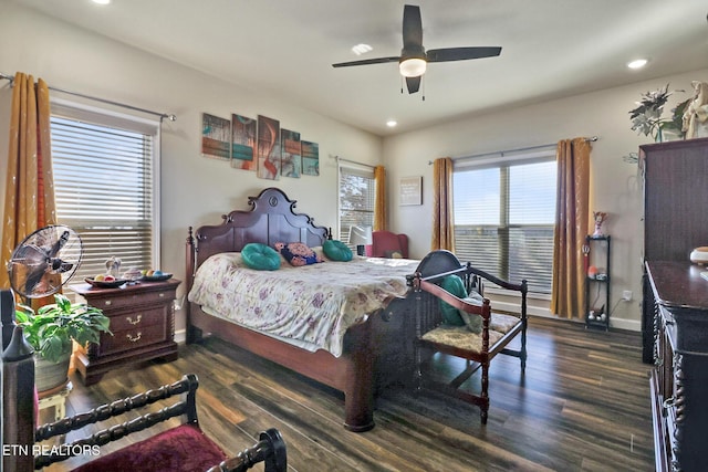 bedroom with ceiling fan and dark hardwood / wood-style flooring