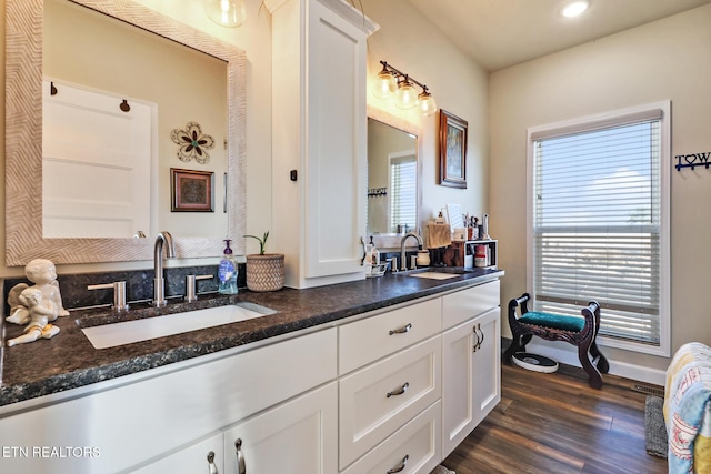 bathroom featuring hardwood / wood-style floors and vanity