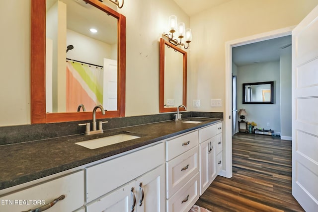 bathroom featuring wood-type flooring and vanity