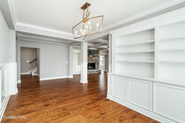 330 Kendall Hunt St, Knoxville, TN 37934 - unfurnished dining area featuring ornamental molding, coffered ceiling, a chandelier, dark hardwood / wood-style floors, and a stone fireplace