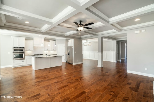 330 Kendall Hunt St, Knoxville, TN 37934 - unfurnished living room with dark wood-type flooring, coffered ceiling, beamed ceiling, ceiling fan with notable chandelier, and ornamental molding