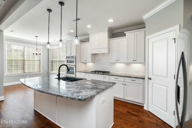 330 Kendall Hunt St, Knoxville, TN 37934 - kitchen with white cabinets, dark hardwood / wood-style flooring, an island with sink, and hanging light fixtures