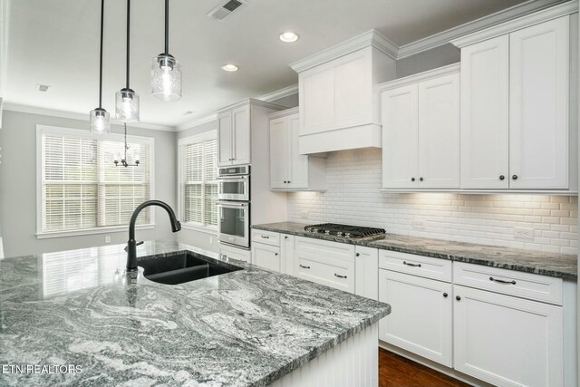 330 Kendall Hunt St, Knoxville, TN 37934 - kitchen featuring white cabinets, decorative light fixtures, sink, and stainless steel appliances