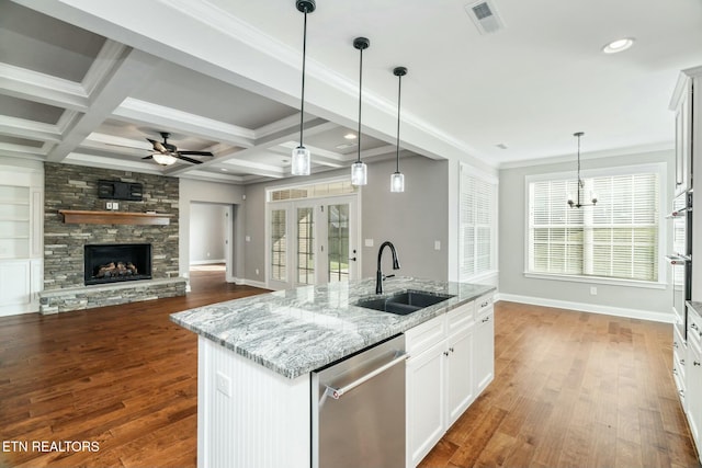 330 Kendall Hunt St, Knoxville, TN 37934 - kitchen featuring stainless steel dishwasher, coffered ceiling, sink, a center island with sink, and white cabinetry