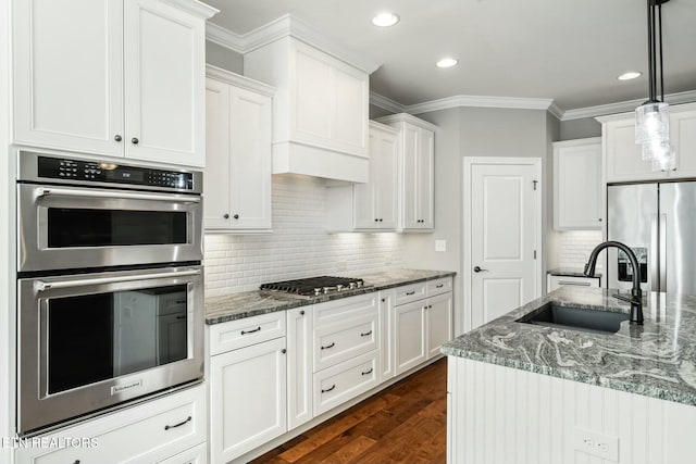 330 Kendall Hunt St, Knoxville, TN 37934 - kitchen with appliances with stainless steel finishes, dark hardwood / wood-style flooring, white cabinetry, and sink