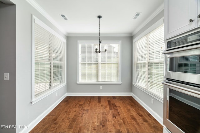 330 Kendall Hunt St, Knoxville, TN 37934 - unfurnished dining area with a notable chandelier, dark hardwood / wood-style floors, and crown molding