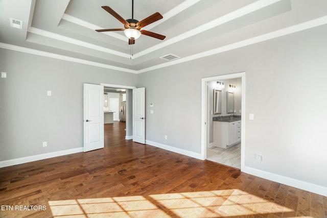 330 Kendall Hunt St, Knoxville, TN 37934 - unfurnished bedroom with ceiling fan, a raised ceiling, connected bathroom, and light hardwood / wood-style flooring